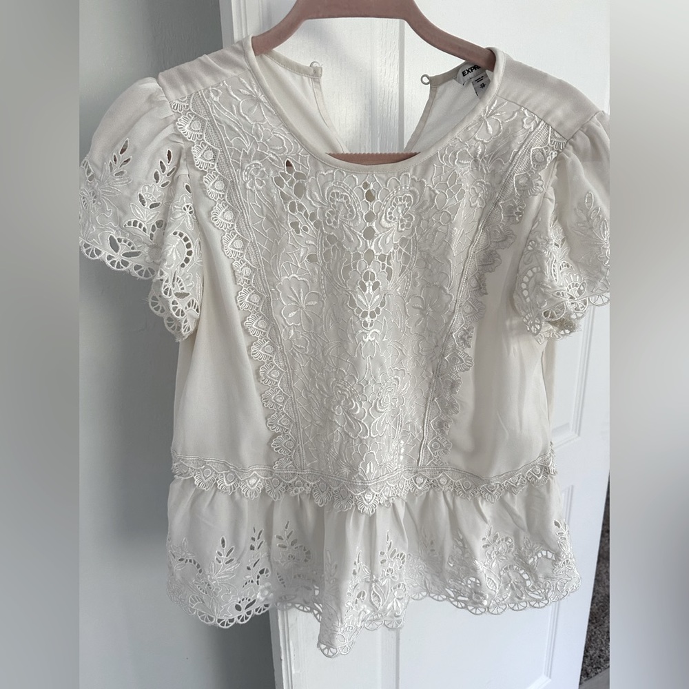 Express White Top. Adorable feminine look with embroidery